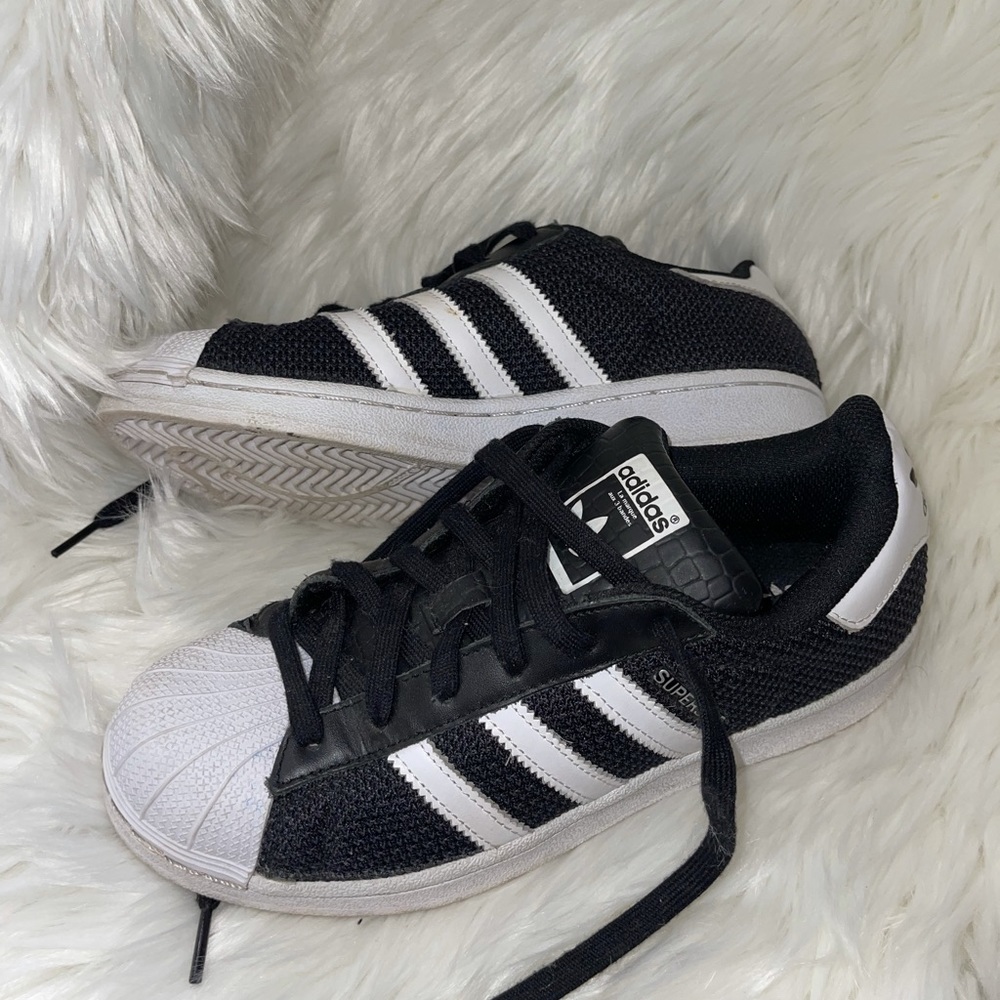 Adidas, black and white superstar sneakers.
